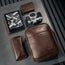 Dark Brown Leather Crossbody Shoulder Satchel Bag with items to show size and capacity