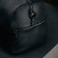 Side pocket on the Black Leather Weekend Duffle Bag