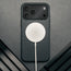 MagSafe charger attached to the Slimline Black Leather Bumper Case for iPhone 17 Pro