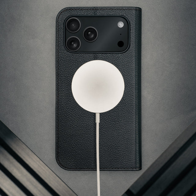 MagSafe charger attached to the Black Leather Case for iPhone 17 Pro