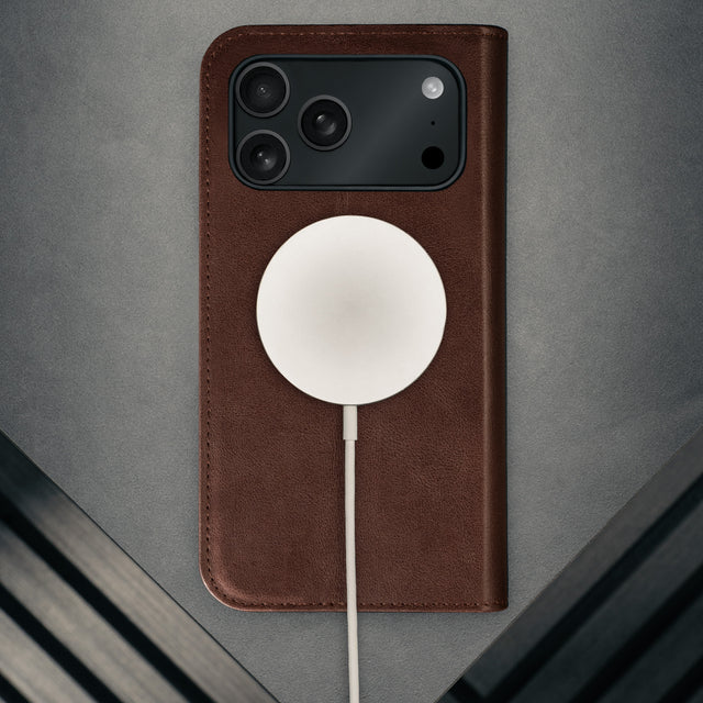 MagSafe charger attached to the Dark Brown Leather Case for iPhone 17 Pro