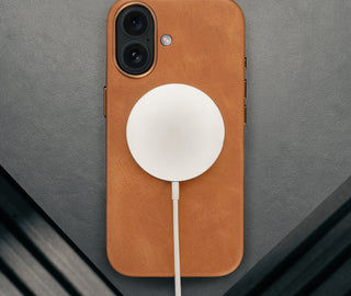 MagSafe charger attached ot the Tan Leather Bumper Case for iPhone 17
