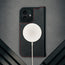 MagSafe charger attached to the Black (with Red Detail) Leather Case for iPhone 17