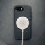 MagSafe charger attached to the Black Slimline Leather Bumper Case for iPhone SE4 (2025)