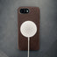 MagSafe charger attached to the Dark Brown Slimline Leather Bumper Case for iPhone SE4 (2025)