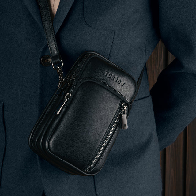 Black Leather Phone Bag worn over a model's shoulder