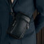 Black Leather Phone Bag worn over a model's shoulder
