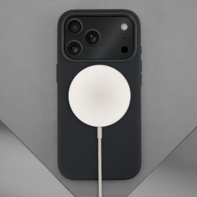 Wireless charger attached to the Black Woven Fabric Bumper Case for iPhone 17 Pro Max