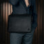Removing laptop from the Black Leather Messenger Bag