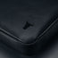 Black Leather Messenger Bag on a wooden table