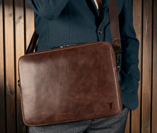 Man carrying the Dark Brown Leather Messenger Bag