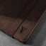 Close up of the leather grain and TORRO bulls head logo on the Dark Brown Leather Case for iPad Pro 12.9-inch